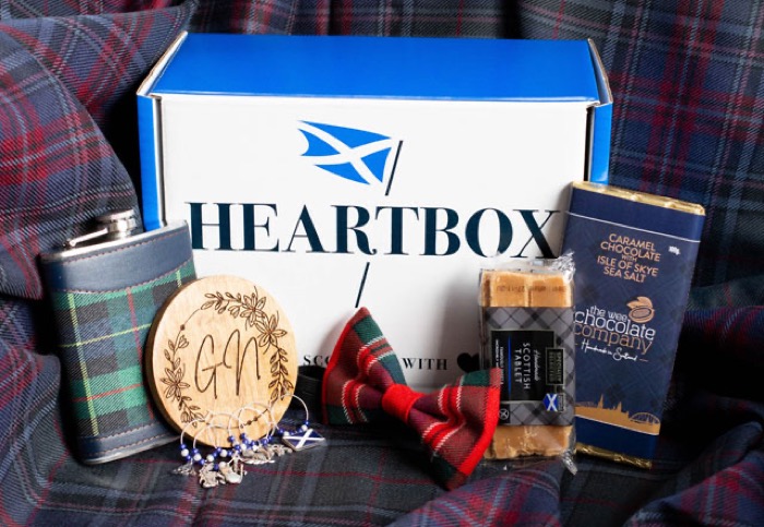 A Summer Celebration Heartbox with a tartan hip flask and bow tie